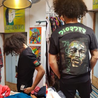 Bob Marley Customised T-Shirt, a print from an original painting by Disorder, on a black organic cotton, sustainable, carbon neutral t-shirt in Britain.